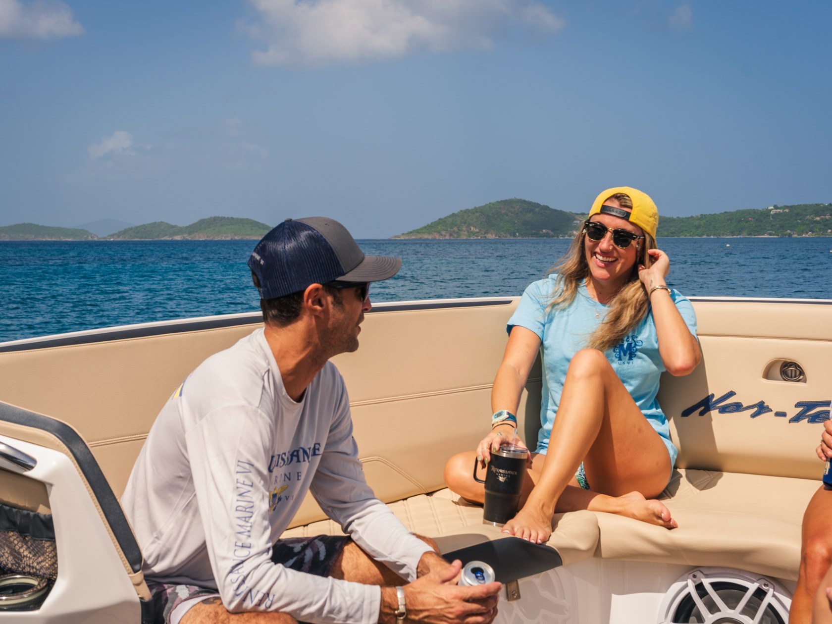 a couple of people sitting at a beach