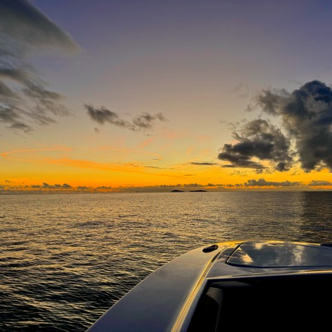 a sunset over a body of water