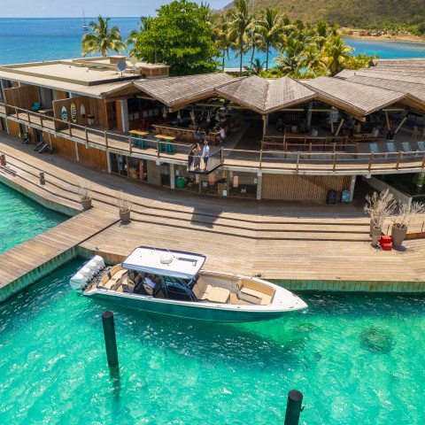 a boat is docked next to a body of water
