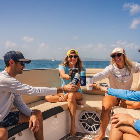 a group of people riding on the back of a boat