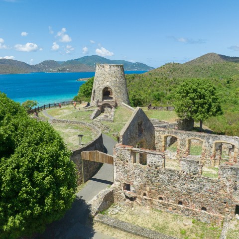 a castle surrounded by a body of water