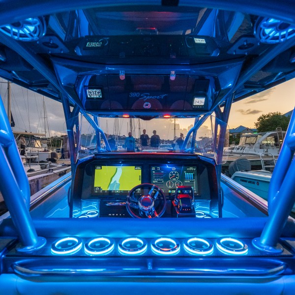 a blue car on a train track